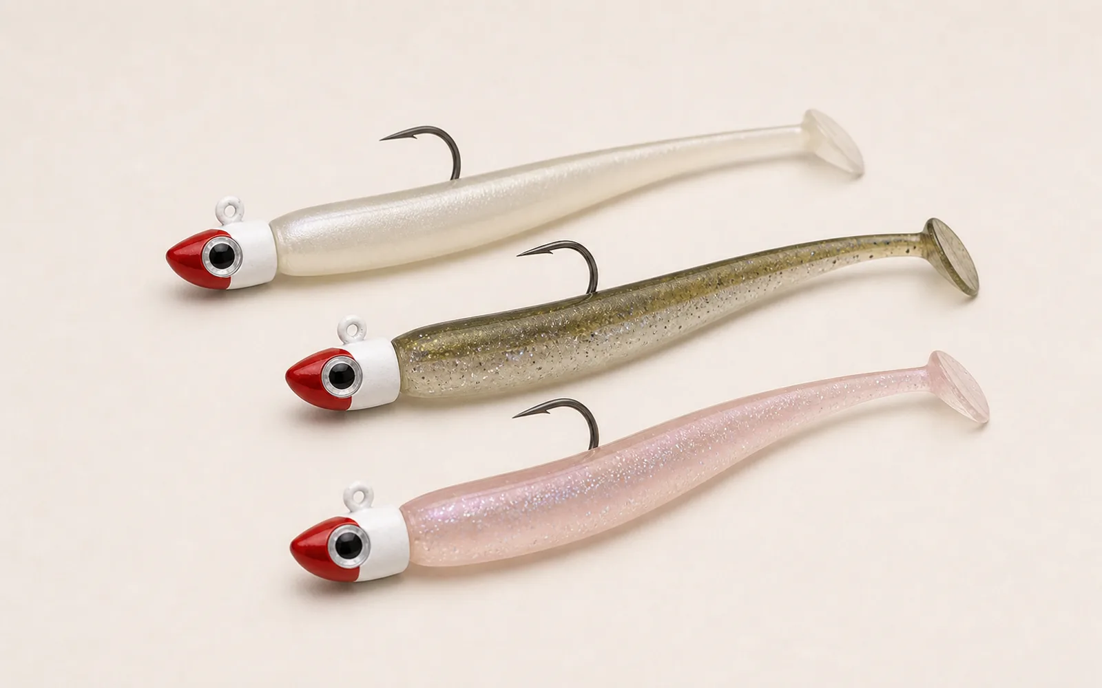 Rigged shallow-water eel-style soft baits on red and white jigheads with single hooks